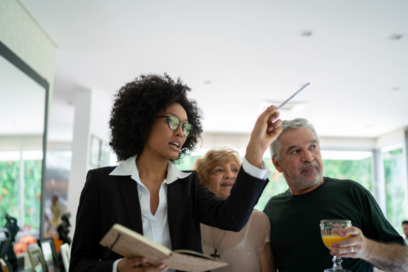 a real estate agent in Las Vegas guiding senior couple