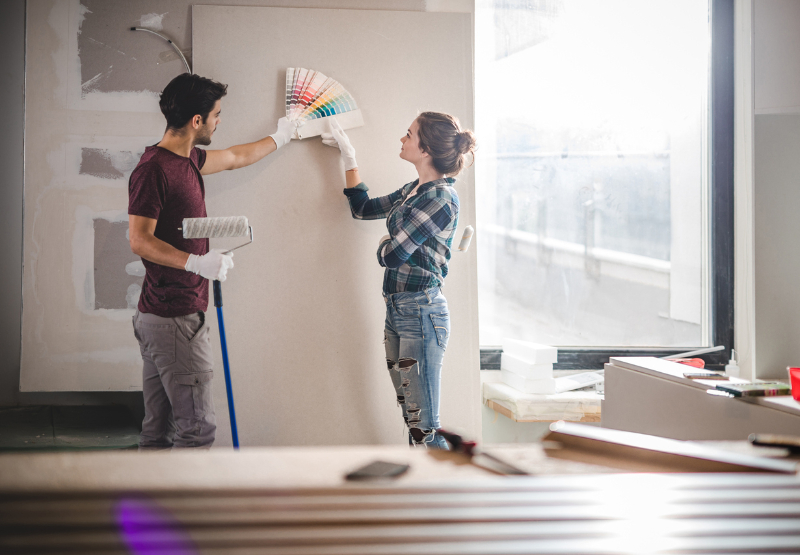 Couple thinking for right paint wall