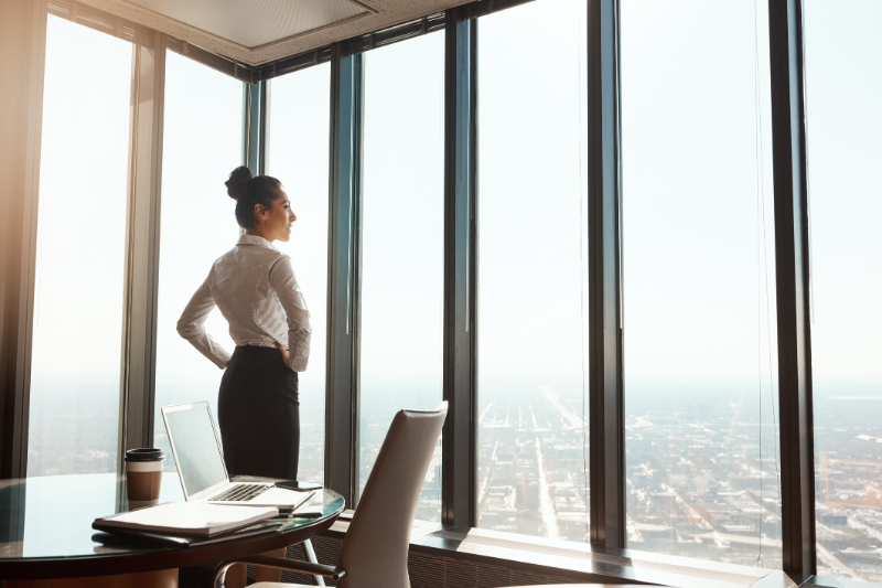 woman looking on the office window