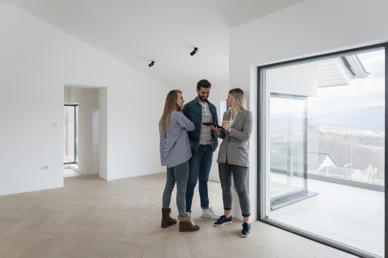 couple talking to a realtor